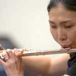 Photo by Rashah McChesney/Peninsula Clarion  Soldotna-based Flutist Tomoka Raften plays for a group of students on Wednesday Nov. 4, 2015 at Soldotna High School in Soldotna, Alaska. Raften and Kenai-based pianist Maria Allison will perform on Nov. 7 at the Soldotna Christ Lutheran Church.