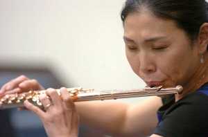 Photo by Rashah McChesney/Peninsula Clarion  Soldotna-based Flutist Tomoka Raften plays for a group of students on Wednesday Nov. 4, 2015 at Soldotna High School in Soldotna, Alaska. Raften and Kenai-based pianist Maria Allison will perform on Nov. 7 at the Soldotna Christ Lutheran Church.