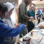 Photo by Megan Pacer/Peninsula Clarion Students and visitors enjoy locally-made fry bread during the kick-off event for Alaska Native/Native American Heritage Month on Thursday, Nov. 5, 2015 in the McLane Commons at Kenai Peninsula College.