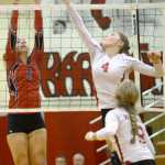 Ben Boettger/Peninsula Clarion Kenai volleyball player Alexis Baker (left) attempts to stop a tip from Wasilla's  during a game on Friday Nov. 7 at Kenai Central High School.