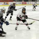 Ben Boettger/Peninsula Clarion Kenai hockey player Ian Mercado attempts to keep the puck from Soldotna's Cole Crandall during a game on Saturday, Nov. 7 at the Soldotna Sports Center.