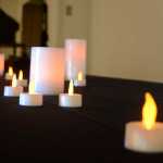 Photo by Megan Pacer/Peninsula Clarion Residents and health care staff members placed lights representing their lost loved ones at the front of the room during the annual Time of Remembrance celebration on Sunday, Nov. 8, 2015 at Central Peninsula Hospital in Soldotna, Alaska.