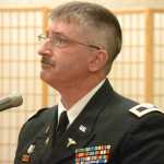 Photo by Megan Pacer/Peninsula Clarion Col. James Halliday, a dental surgeon for the Alaska National Guard, talks about his time serving his country during a Celebrating Heros event on Tuesday, Nov. 10, 2015 at the Kenai Senior Citizens Center in Kenai, Alaska. Halliday first began serving in the military in 1982.