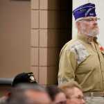 Photo by Rashah McChesney/Peninsula Clarion  Nearly 100 people stood - many saluted - as the colors were retired during a Veterans Day ceremony on Wednesday Nov. 11, 2015 in Soldotna, Alaska.