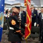 Photo by Rashah McChesney/Peninsula Clarion An audience member watches the color guard before a Veterans Day ceremony on Wednesday Nov. 11, 2015 in Soldotna, Alaska.