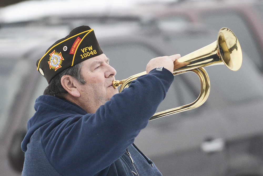 Photo by Rashah McChesney/Peninsula Clarion Richard Williams and Anne Toutant guard the colors during a Veterans Day ceremony on Wednesday Nov. 11, 2015 in Soldotna, Alaska.