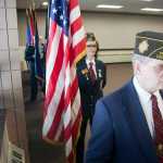 Photo by Rashah McChesney/Peninsula Clarion Members of Kenai's American Legion Post 20 salute during the posting of the colors at a Veterans Day ceremony on Wednesday Nov. 11, 2015 in Soldotna, Alaska.