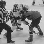 Photos by Joey Klecka/Peninsula Clarion Matthew Daugherty (15) attempts to collect the puck on a faceoff near the Soldotna goal Thursday at the Soldotna Regional Sports Complex.