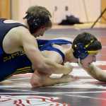 Photo by Rashah McChesney/Peninsula Clarion Homer's Tristen Cook tries to escape a hold during the 2015 Peninsula Duals on Friday Nov. 13, 2015 in Nikiski, Alaska.