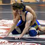 Photo by Rashah McChesney/Peninsula Clarion Homer's Tristen Cook starts on the ground during the 2015 Peninsula Duals on Friday Nov. 13, 2015 in Nikiski, Alaska.