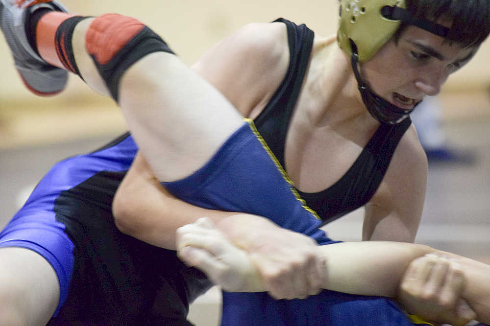 Photo by Rashah McChesney/Peninsula Clarion Soldotna's Gideon Hutchinson wrestles Homer's Seth Inama during the Peninsula Duals on Friday Nov. 13, 2015 in Nikiski, Alaska.