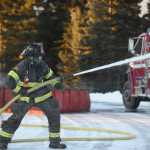 Photo by Megan Pacer/Peninsula Clarion Central Emergency Services firefighters fill a collapsable tank with water in preparation for a drill on Tuesday, Nov. 17, 2015 at the department's station on Kalifornsky Beach Road. The firefighters have been training for about two months for an upcoming engineering test.