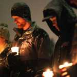 Ben Boettger/Peninsula Clarion Candle-holders pray during the conclusion of the 6th annual candlelight vigil for homeless youth at Soldotna's Farnsworth Park on Thursday, Nov. 20 in Soldotna.