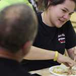 Photo by Kelly Sullivan/ Peninsula Clarion Junior Glenda and her father Wade Armstrong attended Kenai Alternative's Thanksgiving lunch together Tuesday, Nov. 17, 2015, at Kenai Altnerative High School in Kenai, Alaska.