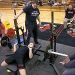 Photo by Rashah McChesney/Peninsula Clarion  Kenai Central High School Student Mackenzi Lindeman bench presses during the Dena'ina Powerlifing Meet on Saturday Nov. 21, 2015 in Kenai, Alaska.