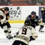 Photo by Rashah McChesney/Peninsula Clarion  Brown Bears' Jack Gessert outmaneuvers Janesville Jets' Taylor Fernandez during their game on Friday Nov. 20, 2015 in Soldotna, Alaska.