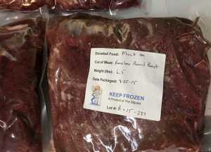 This Sept. 4, 2015 photo released by the U.S. Public Health Service shows a package of donated musk ox meat in Kotzebue, Alaska. Now that the long-term senior care facility in Kotzebue just began incorporating traditional foods into the regular menu, its Alaska Native residents no longer have to just wait for monthly family potlucks to enjoy the taste of the subsistence foods they grew up with. (Chris Dankmeyer/U.S. Public Health Service via AP)