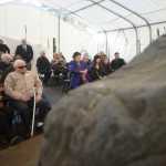 Photo by Megan Pacer/Peninsula Clarion Richard Morgan, center, awaits the start of a dedication ceremony to honor members of Kenai's Charter Commission on Sunday, Nov. 29, 2015 in front of City Hall in Kenai, Alaska. Morgan, the last living member of that commission, was asked to cut the Cornerstone Rock's ceremonial ribbon.
