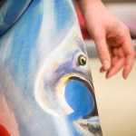 Photo by Rashah McChesney/Peninsula Clarion  A bear stretches across model Sara Christensen's body during a live body painting exhibition on Wednesday Dec. 1, 2015 at Kenai Peninsula College - Kenai River Campus in Soldotna, Alaska.