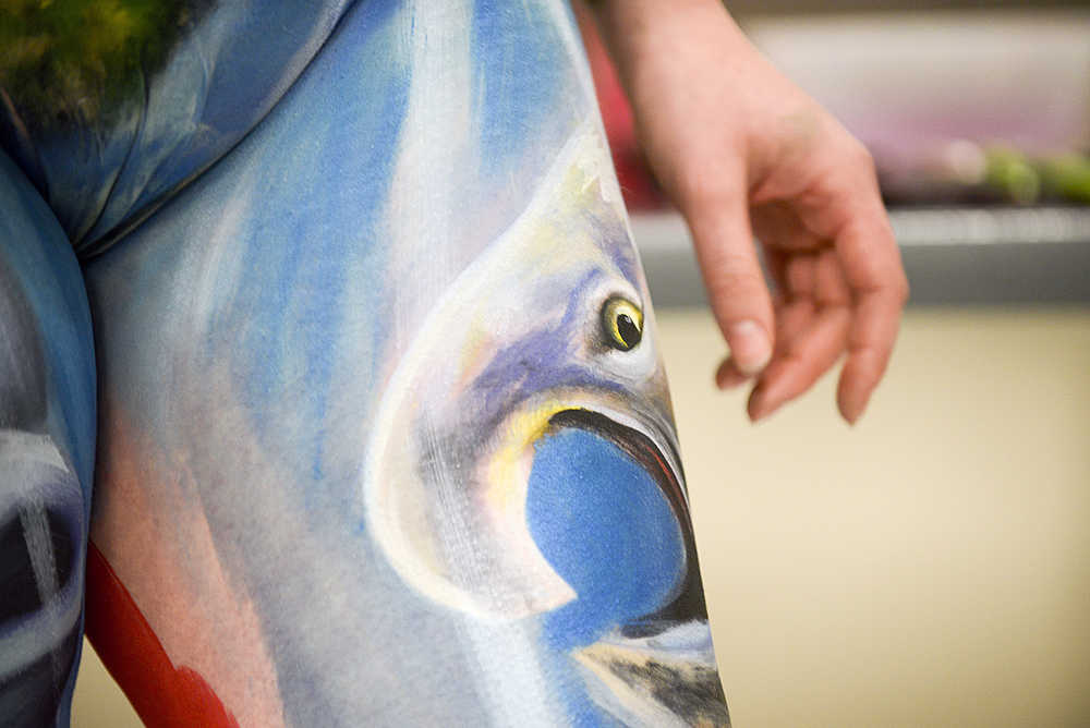 Photo by Rashah McChesney/Peninsula Clarion  A bear stretches across model Sara Christensen's body during a live body painting exhibition on Wednesday Dec. 1, 2015 at Kenai Peninsula College - Kenai River Campus in Soldotna, Alaska.
