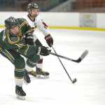 8 gains on Colony Knights' Jacob Kirsch during their game on Thursday Dec. 3, 2015 at the Soldotna Regional Sports Complex in Soldotna, Alaska.