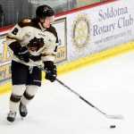 Photo by Rashah McChesney/Peninsula Clarion  Kenai River Brown Bears' Charles Spetz looks for an opening during a game against the Fairbanks Ice Dogs on Friday Dec. 4, 2015 in Soldotna, Alaska. The Ice Dogs beat the Brown Bears 4-1.