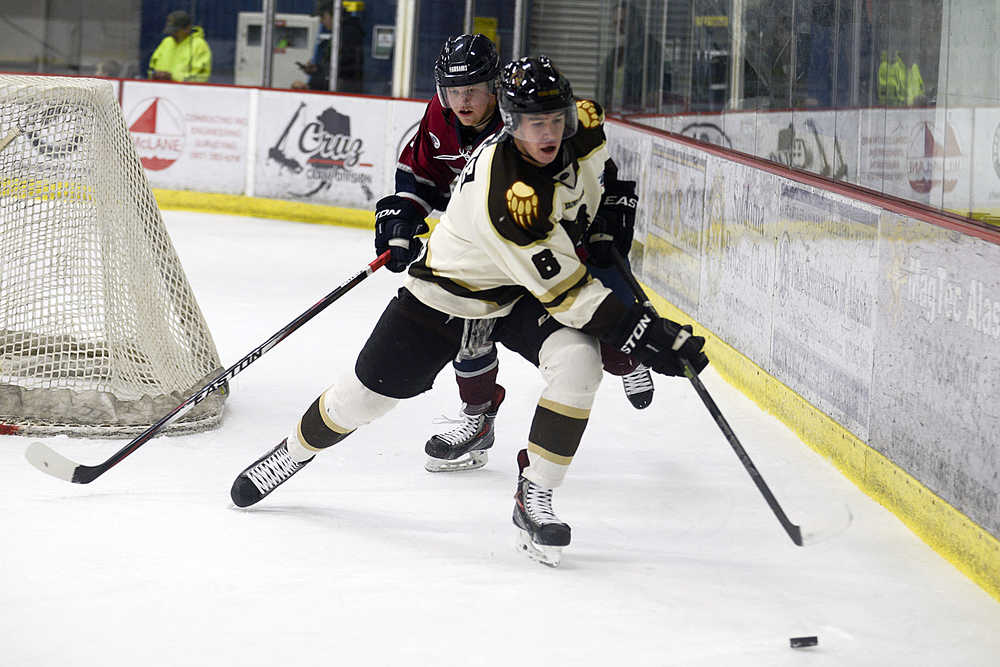 Photo by Rashah McChesney/Peninsula Clarion Kenai River Brown Bears' Thomas Keane out manuevers Fairbanks Ice Dog Liam Stirtzinger during their game on Friday Dec. 4, 2015 in Soldotna, Alaska. The Ice Dogs won 4-1.