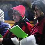 Ben Boettger/Peninsula Clarion Kenai Performers Mike McKinley (left), Sally Cassano, and Terri Burdick sing carols on stage during the Soldotna Christmas tree lighting on Saturday, Dec. 5 in Soldotna Creek Park.