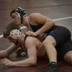 Photo by Joey Klecka/Peninsula Clarion Nikiski's Nathan Carstens wrestles with Houston's Noah Plumb in the 170-pound match in the fifth-place dual at Saturday's North-South Duals tournament at Soldotna Prep.