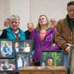 Photo by Rashah McChesney/Peninsula Clarion  Madison Skornik, of Anchorage, Marti Delimont, of Anchorage, Stephanie Huber, of Anchorage and  Kent Ployhar, of Mexico mourn the loss of Sterling resident Jon Ployhar during a memorial on Sunday Dec. 6, 2015 in Sterling, Alaska. Skornik and Huber are Jon Ployhar's neices, while Huber and Kent Ployhar are his siblings. Jon Ployhar was killed during a confrontation with an Alaska State Trooper in October.
