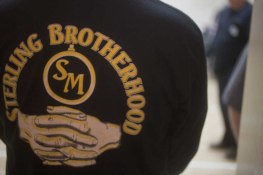 Photo by Rashah McChesney/Peninsula Clarion Members of the Sterling Brotherhood, a neighborhood watch group, attended a memorial service for former member Jon Ployhar on Sunday Dec. 6, 2015 in Sterling, Alaska. Ployhar was killed in a confrontation with an Alaska State Trooper during traffic stop in October.