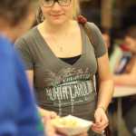 Photo by Kelly Sullivan/ Peninsula Clarion Christa McGahan grabs a morning meal Wednesday, Dec. 9, 2015, at Kenai Alternative High School in Kenai, Alaska.