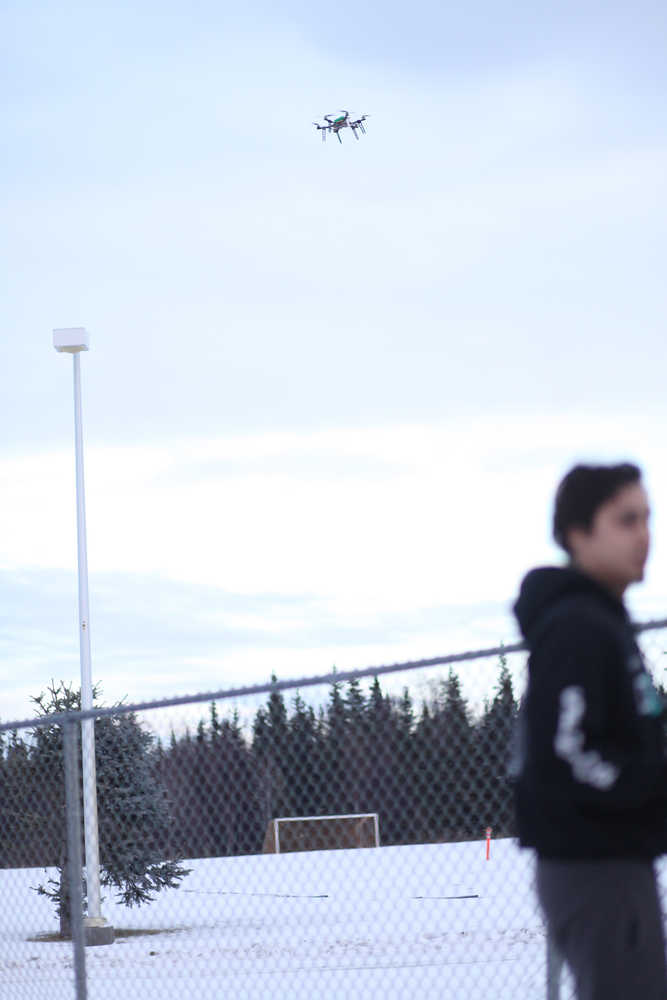 Photo by Kelly Sullivan/ Peninsula Clarion Senior Corin Cooper was in charge of manually flying the drone when autopilot was turned off, Wednesday, Dec. 9, 2015, at Nikiski Middle-High School in Nikiski, Alaska.