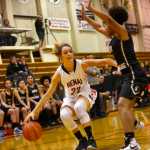 Ben Boettger/Peninsula Clarion Kenai's Alexis Baker attempts to get around South Anchorage's Nani Garner during a game on Friday, Dec. 18 at Kenai Central High School.