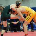Photo by Joey Klecka Homer junior Timmy Woo (right) attacks Wyatt Patten of Craig en route to winning the 152-pound championship at the Class 1-2-3A state wrestling tournament at Bartlett High. Woo helped lead the Homer Mariners to their first wrestling state title since 1986.