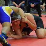 Photo by Joey Klecka Nikiski senior Luke Johnson looks for his next move against Barrow's Tua Mila in the 285-pound championship at the Class 1-2-3A state wrestling tournament at Bartlett High. The win was Johnson's third state crown.