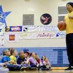 Photo by Rashah McChesney/Peninsula Clarion Tyrone "Hollywood" Brown, a former Harlem Globetrotter, talks to a group of kids about his career path and how he set goals during a presentation on Monday Dec. 21, 2015 in Soldotna, Alaska.