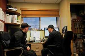 Photo by Elizabeth Earl/Peninsula Clarion Jay Kane (left) and Kole McCaughey (right) manned  Nikiski Fire Station 1 on Christmas Day. Usually, Christmas Day is pretty slow, and the two had plans to make a ham to celebrate.