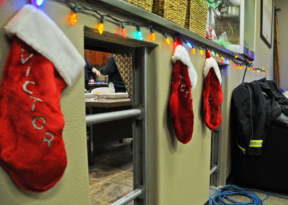 Photo by Elizabeth Earl/Peninsula Clarion The staff at Central Emergency Services gathered at the Soldotna station for Christmas but were ready to go at a moment's notice, with the engines running outside. However, there was only one callout on Christmas day by mid-afternoon.