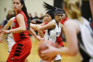 Photo by Kelly Sullivan/ Peninsula Clarion Nikiski Bulldog Arianne Parrish makes sure she is accessible to her team mate during the game against the Houton High School Hawks, Saturday, Jan. 17, 2015, at Nikiski Middle-High School in Nikiski, Alaska.