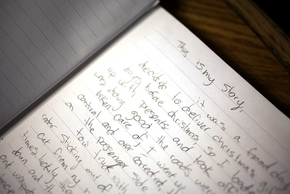 Photo by Rashah McChesney/Peninsula Clarion Nicole Harmon is handwriting a book about her life as she reflects on the traumatic events - first a 2003 car accident, then a 2011 stroke - that resulted in her partial paralyzation and traumatic brain injury.