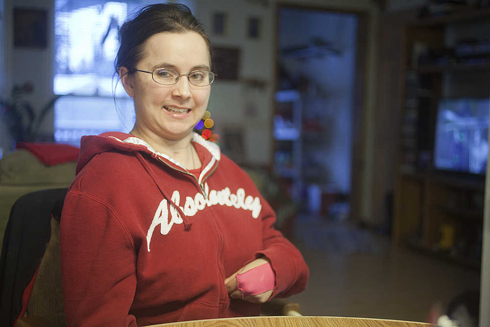 Photo by Rashah McChesney/Peninsula Clarion Nicole Harmon, of Kenai, is recovering after a 2003 car accident and 2011 stroke that left her physically disabled and with the lingering effects of a traumatic brain injury.
