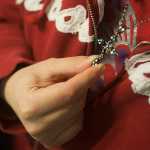 Photo by Rashah McChesney/Peninsula Clarion Nicole Harmon fiddled with a cross that belonged to her mother during an interview about her life following two traumatic events, one a car accident the other a sudden and catastrophic stroke.