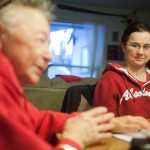 Photo by Rashah McChesney/Peninsula Clarion  Nicole Harmon watches her grandmother Mary Lou Bottorff on Wednesday Dec. 9, 2015 as the two talk to a reporter about Harmon's recovery following a 2003 car accident and seizure in 2011. Despite the challenges, Harmon has graduated high school and is working toward several recovery and life goals.