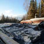 Photo by Megan Pacer/Peninsula Clarion The majority of Jessica Burch and John Schreiber's roof is clad in a tarp on Thursday, Dec. 31, 2015 in Sterling, Alaska, after a wind storm stripped a large section of their home's roof out of place.