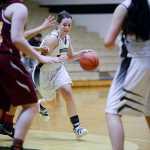Photo by Rashah McChesney/Peninsula Clarion Nikiski's Hallie Riddall dodges around a Mt. Edgecumbe player during their game on Saturday Jan. 9, 2015 in Nikiski, Alaska. Nikiski lost the game 63-24.