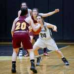 Photo by Rashah McChesney/Peninsula Clarion Nikiski's Kelsey Clark guards a Mt. Edgecumbe player during their game on Saturday Jan. 9, 2016 in Nikiski, Alaska. Mt. Edgecumbe won the game 63-24.