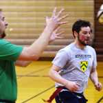 Ben Boettger/Peninsula Clarion Dustin Henkin (left) recieves a pass from Dan Balmer at the Kenai Wolfpack Rugby club introductory clinic on Tuesday, Jan. 19 at Soldotna Prepatory School.