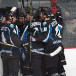 Photo by Jeff Helminiak/Peninsula Clarion Jake Hartje, Evan Butcher, Austin Junger and Collin Appleton celebrate Butcher's first-period goal Friday, Jan. 22, 2016, at the Soldotna Regional Sports Complex.