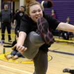 Ben Boettger/Peninsula Clarion Hannah Wilson makes a leap during the one foot high kick game at the Native Youth Olympics Winter Games Invitational on Saturday, Jan. 23 at Kenai Middle School.